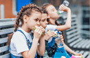 Three child eat, appetizing school lunch  Healthy school lunch: apple, juice, hamburger, vegetable,after education  