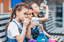 Three child eat, appetizing school lunch  Healthy school lunch: apple, juice, hamburger, vegetable,after education  