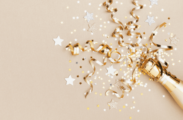 Celebration background with golden champagne bottle, confetti stars and party streamers  Christmas, birthday or wedding concept  Flat lay 