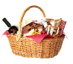 Wicker basket full of gifts isolated on white