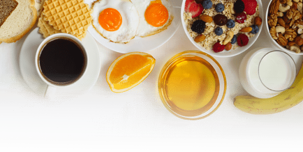 Healthy breakfast with muesli, fruits, berries, nuts, coffee, eggs, honey, oat grains and other on white background  Flat lay, top view, copy space for text, frame