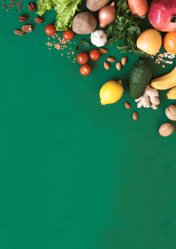 Healthy vegan food assortment. Organic vegetarian food ingredients vegetables and fruits on green background, copy space, banner. Clean vegan eating and detox concept.