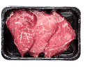 Vacuum-packed beef on a white background. Marbled beef from the store isolated on a white background.