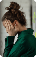 Young sad woman in office, having troubles.